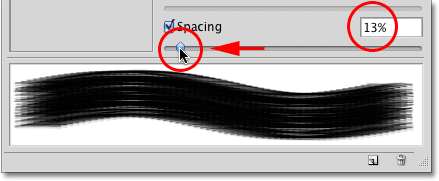 Lowering the brush Spacing amount in the Brushes panel in Photoshop. 
