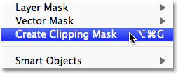 Selecting the Create Clipping Mask command from the Layer menu in Photoshop.