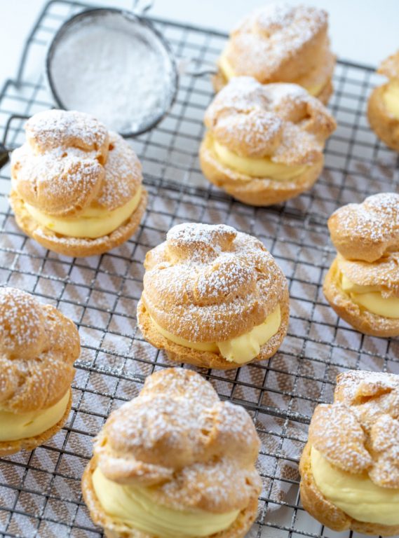 My famous Homemade Cream Puffs recipe: light and airy cream puffs filled with vanilla pudding cream are always a hit with family and anyone I