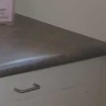 dark laminate countertop on white cabinets
